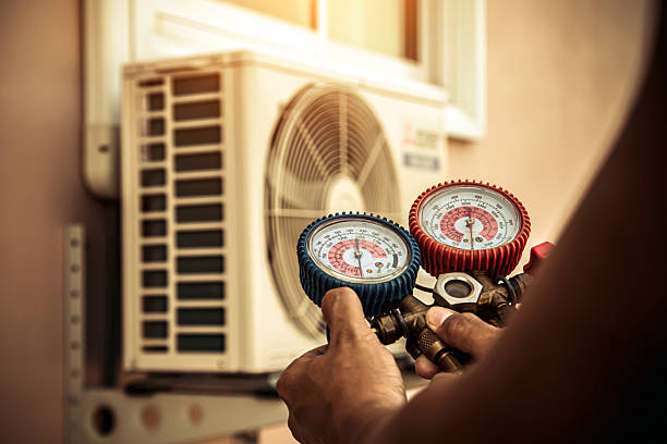 Professional Heat Pump Repair technician working in Erie, KS